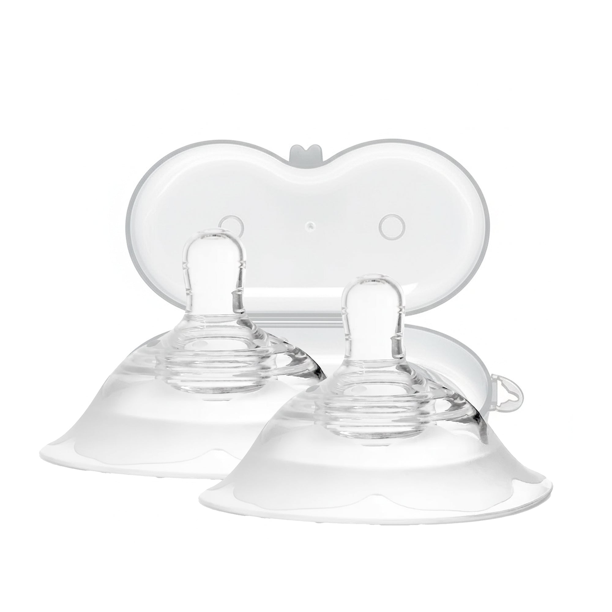 Clear baby feeding nipples on a white background