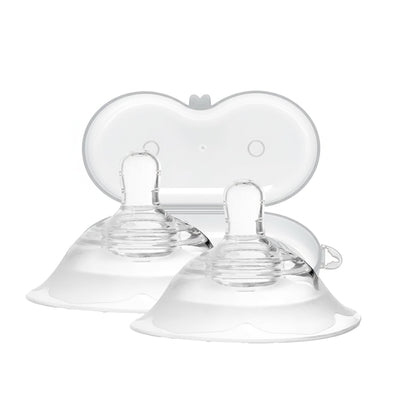 Clear baby feeding nipples on a white background